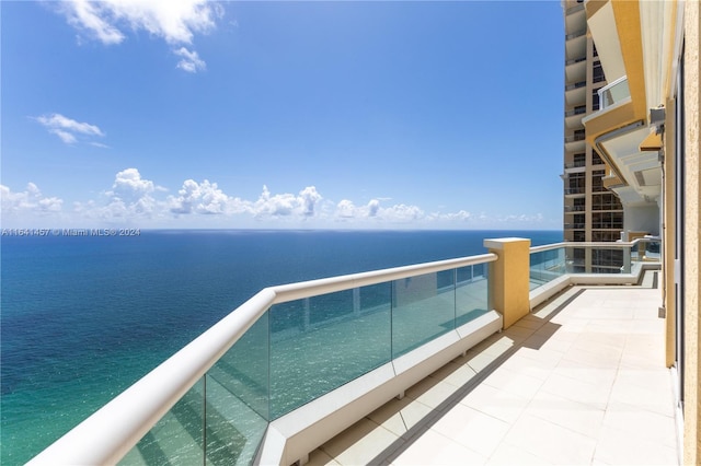 balcony featuring a water view