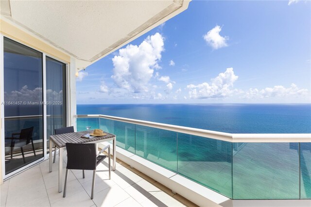 balcony featuring a water view