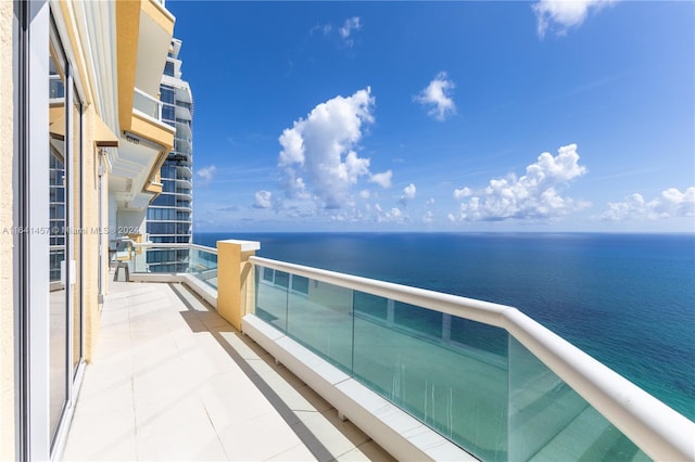 balcony featuring a water view