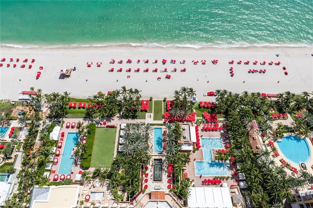 aerial view featuring a water view and a beach view