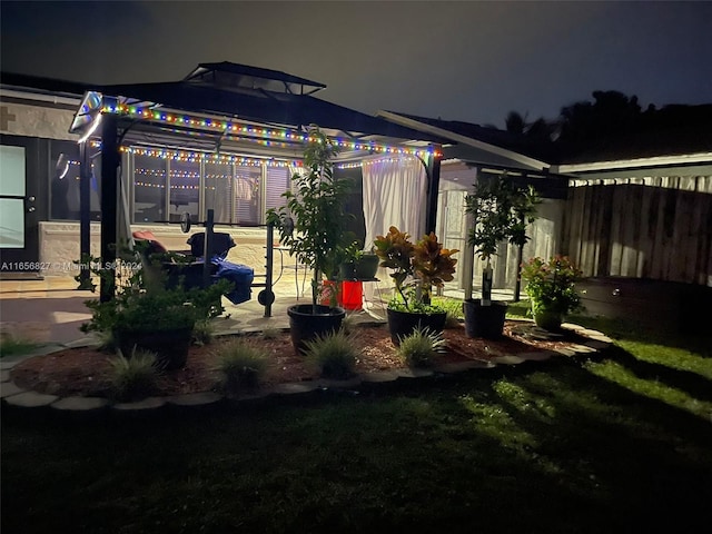 view of yard at twilight