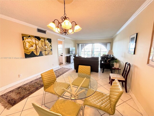 dining space with ornamental molding and a textured ceiling