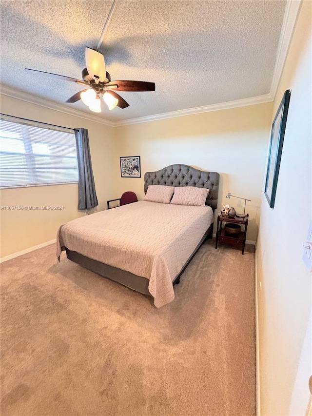 bedroom featuring a textured ceiling, carpet flooring, ceiling fan, and crown molding