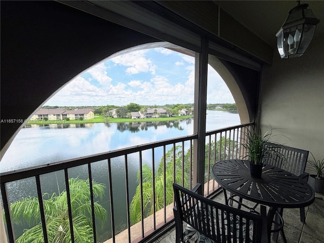 balcony featuring a water view