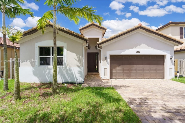 mediterranean / spanish house featuring a garage