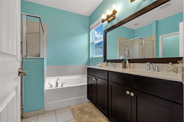 bathroom featuring vanity, separate shower and tub, and tile patterned floors