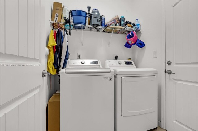 laundry room featuring separate washer and dryer