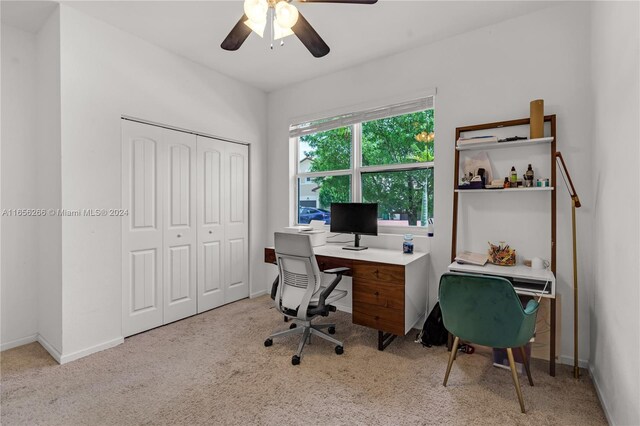 office area featuring ceiling fan and light carpet