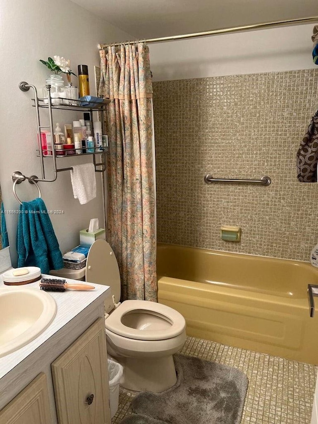 full bathroom featuring vanity, toilet, tile patterned floors, and shower / bathtub combination with curtain