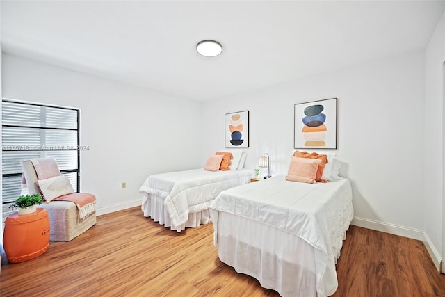 bedroom featuring hardwood / wood-style flooring