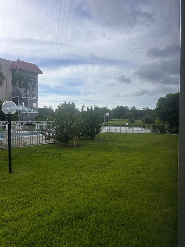 view of yard with a community pool