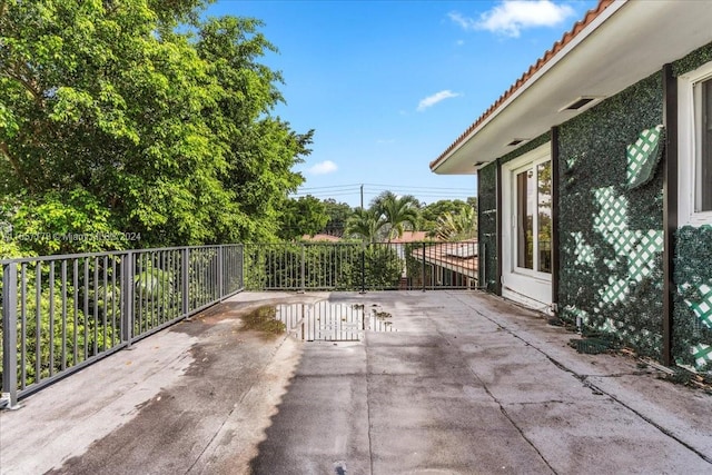 view of patio featuring a balcony