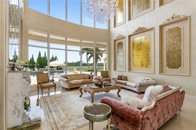 living room with an inviting chandelier and a high ceiling