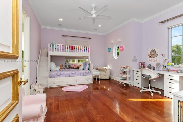 bedroom featuring ceiling fan, ornamental molding, and wood-type flooring