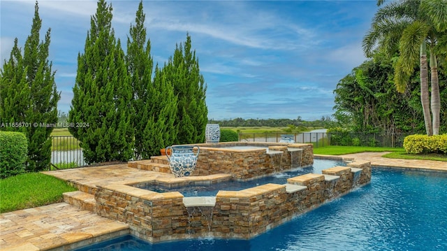 view of swimming pool featuring pool water feature