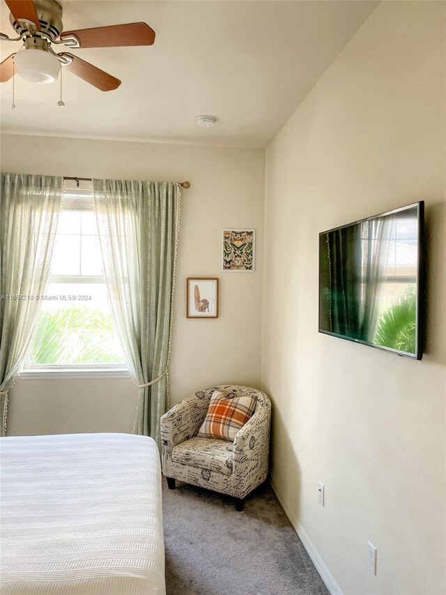 carpeted bedroom featuring ceiling fan