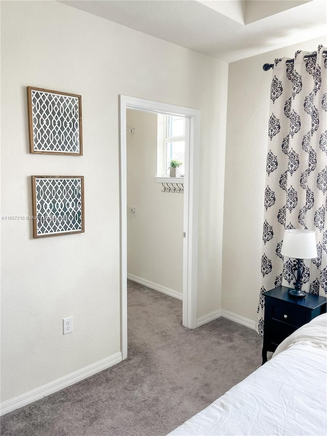 unfurnished bedroom with carpet flooring