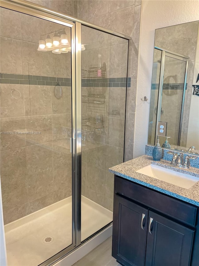 bathroom featuring vanity and walk in shower