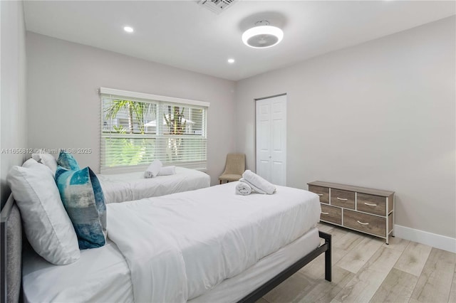 bedroom with light wood-type flooring