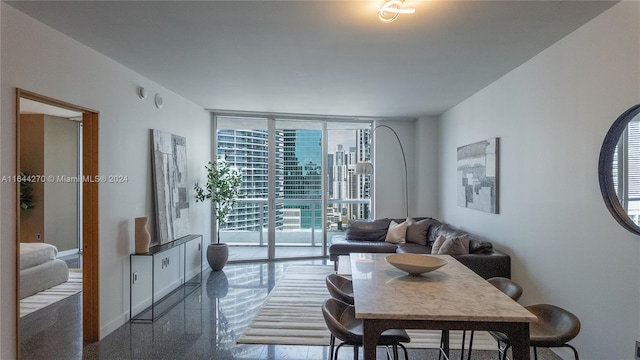 living room featuring a wall of windows