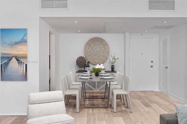 dining area with visible vents, wood finished floors, and recessed lighting