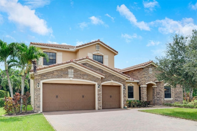 mediterranean / spanish home featuring a garage