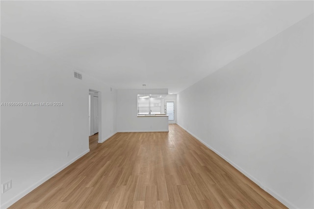 spare room featuring light hardwood / wood-style floors