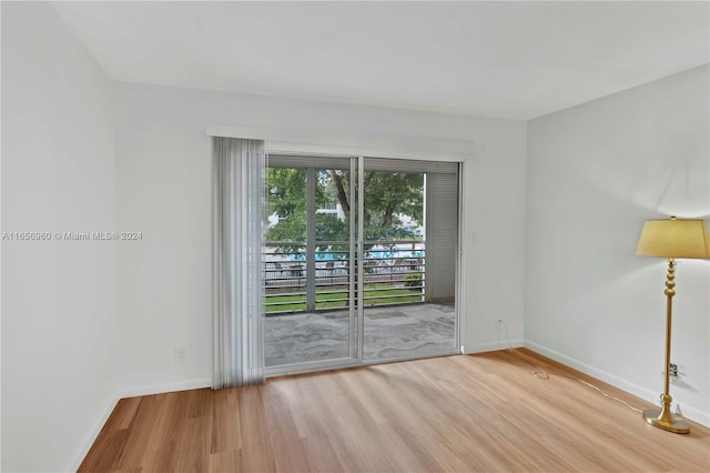 spare room with light wood-type flooring