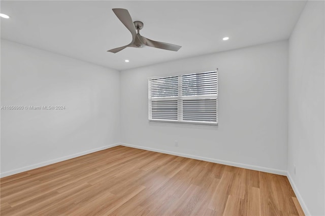 empty room featuring ceiling fan and light hardwood / wood-style floors