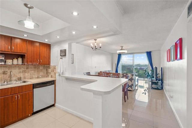 kitchen featuring light tile patterned floors, dishwasher, sink, a raised ceiling, and kitchen peninsula