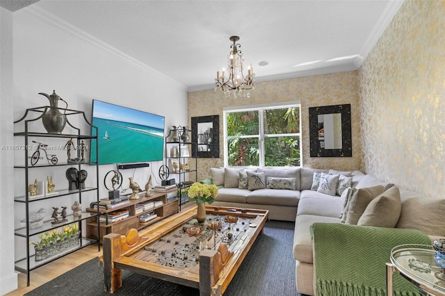 living room featuring hardwood / wood-style floors, an inviting chandelier, and ornamental molding