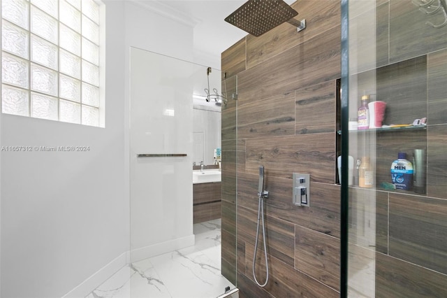 bathroom with vanity and a tile shower