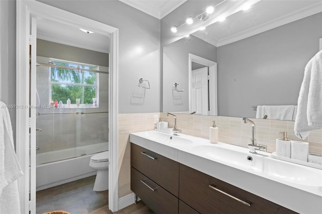 full bathroom with vanity, toilet, ornamental molding, decorative backsplash, and enclosed tub / shower combo