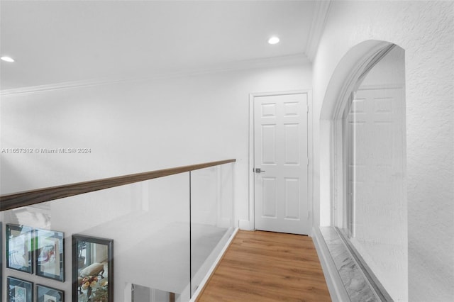 hallway featuring crown molding and wood-type flooring