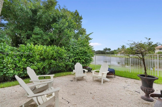 view of patio with a water view