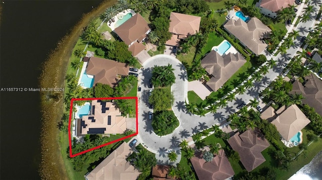 birds eye view of property featuring a water view