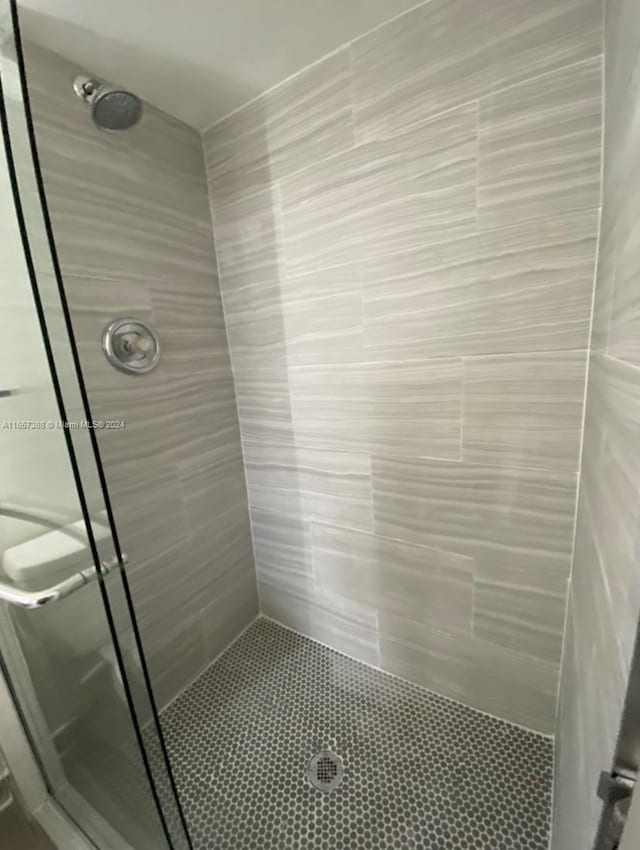 bathroom with tiled shower