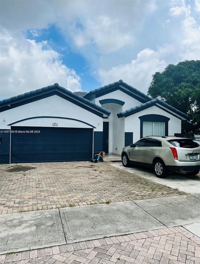 view of front of property featuring a garage