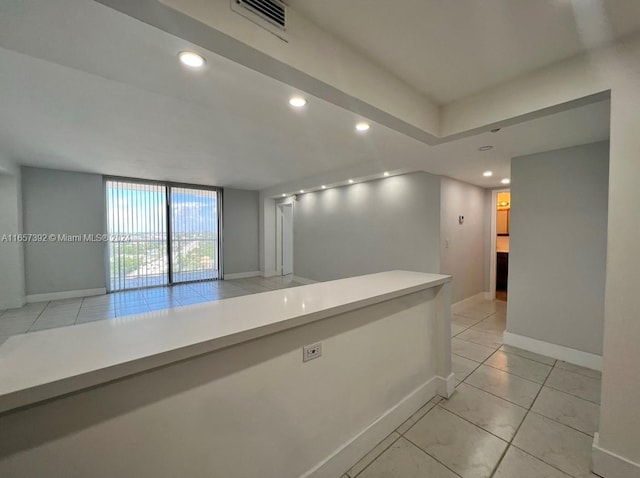 interior space with light tile patterned floors