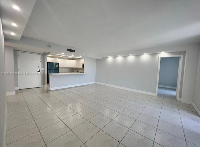 13499 Biscayne Blvd Unit 1405, North Miami, FL 33181 - unfurnished living room with recessed lighting, baseboards, and light tile patterned flooring