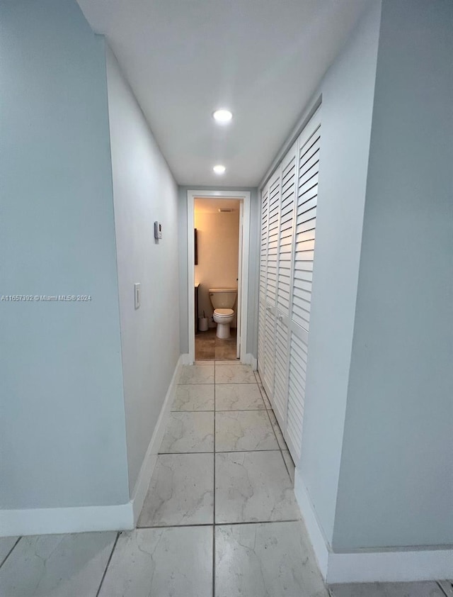 13499 Biscayne Blvd Unit 1405, North Miami, FL 33181 - corridor featuring light marble finish flooring, baseboards, and recessed lighting
