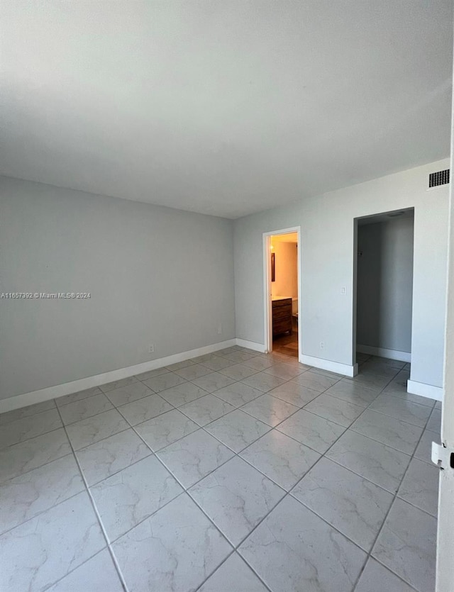 13499 Biscayne Blvd Unit 1405, North Miami, FL 33181 - spare room with light marble finish flooring and baseboards
