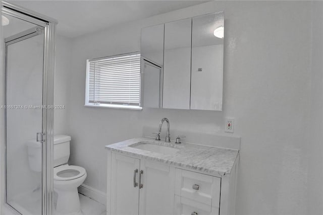 bathroom with an enclosed shower, toilet, and vanity