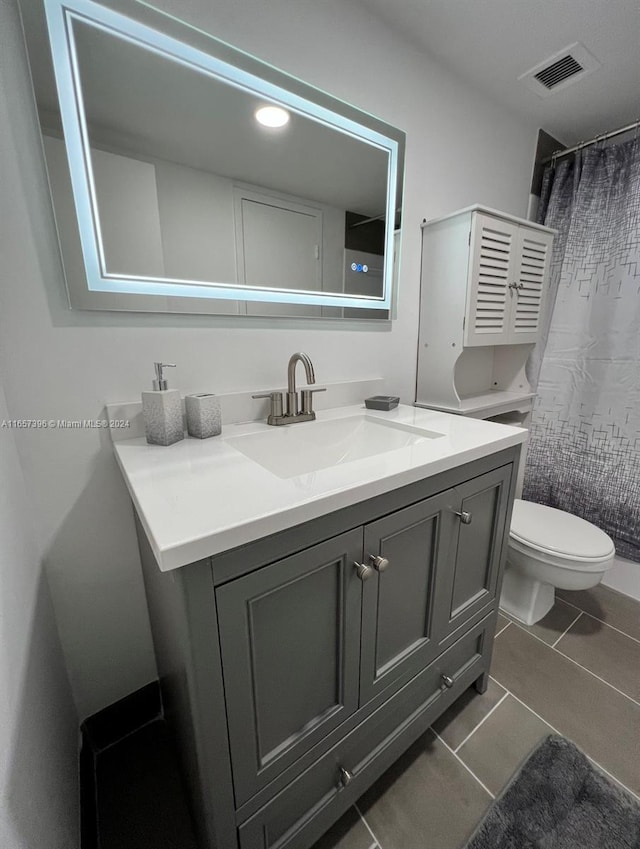13499 Biscayne Blvd Unit 1205, North Miami, FL 33181 - bathroom with vanity, toilet, tile patterned floors, a shower with shower curtain, and recessed lighting