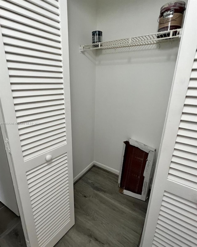 walk in closet featuring dark hardwood / wood-style floors