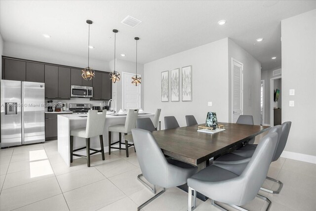 7740 Sandy Ridge Dr Unit 112, Kissimmee, FL 34747 - dining room with light tile patterned floors, recessed lighting, and baseboards