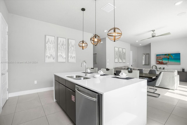 kitchen with ceiling fan, dishwasher, sink, an island with sink, and decorative light fixtures