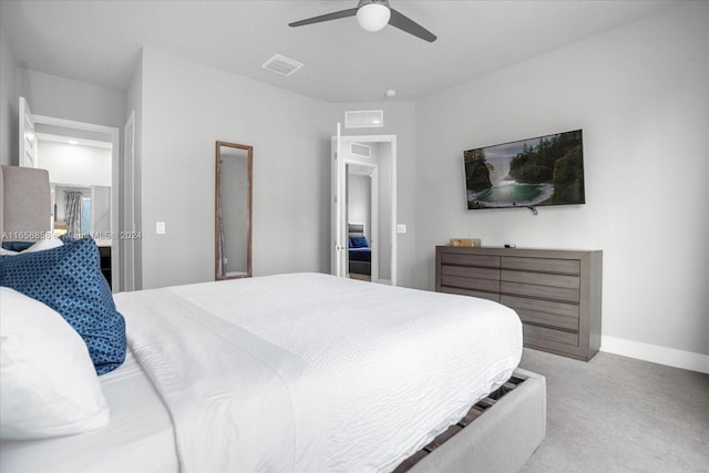 bedroom featuring light colored carpet and ceiling fan