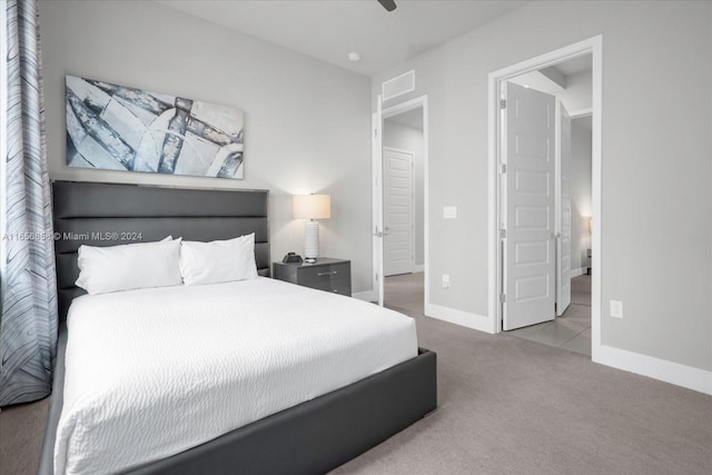 carpeted bedroom with ceiling fan