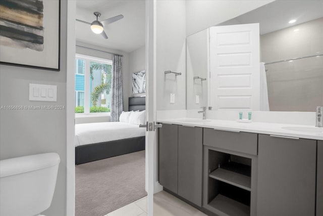 7740 Sandy Ridge Dr Unit 112, Kissimmee, FL 34747 - ensuite bathroom with toilet, double vanity, ceiling fan, tile patterned floors, and recessed lighting